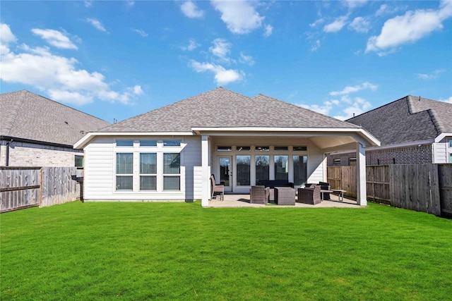 9306 Eckert Rd, Iowa Colony, TX 77583 - back of property featuring a fenced backyard, a yard, a patio, and an outdoor hangout area
