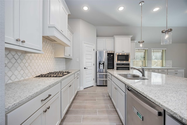 9306 Eckert Rd, Iowa Colony, TX 77583 - kitchen featuring a sink, white cabinets, backsplash, and stainless steel appliances