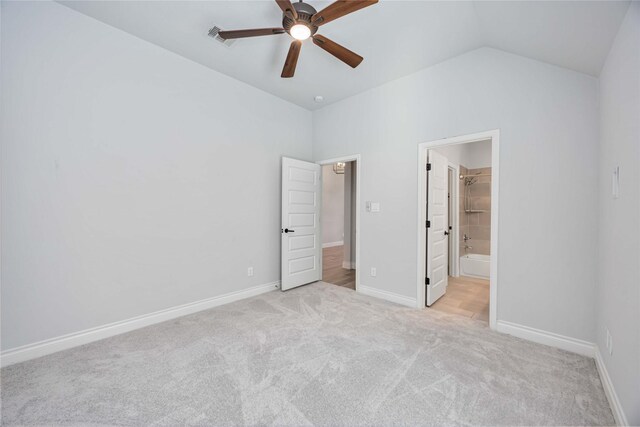 9306 Eckert Rd, Iowa Colony, TX 77583 - unfurnished bedroom featuring visible vents, carpet flooring, vaulted ceiling, and baseboards