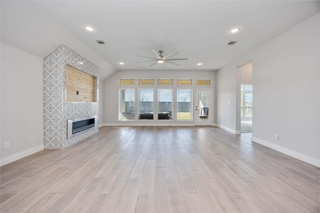 9306 Eckert Rd, Iowa Colony, TX 77583 - unfurnished living room featuring a healthy amount of sunlight, visible vents, a ceiling fan, and recessed lighting