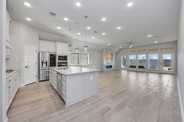 9306 Eckert Rd, Iowa Colony, TX 77583 - kitchen with a wealth of natural light, visible vents, a ceiling fan, and appliances with stainless steel finishes