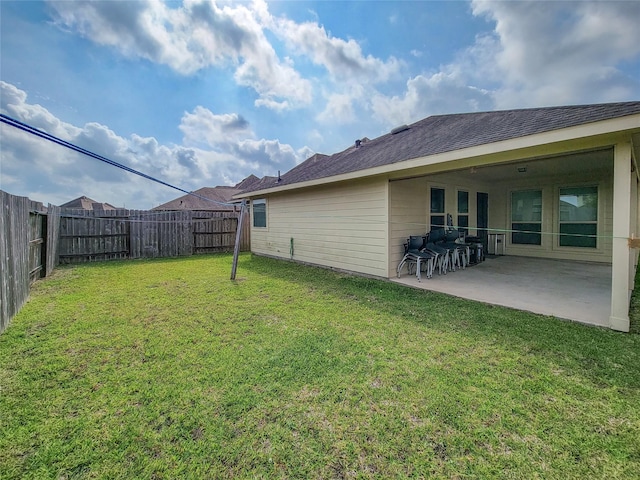 view of yard featuring a patio and a fenced backyard