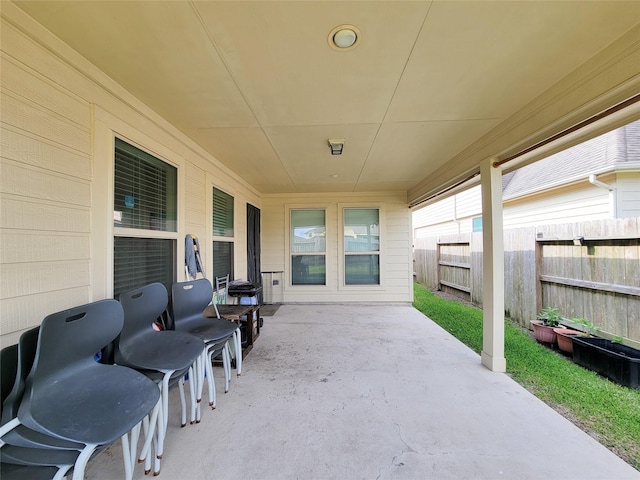 view of patio / terrace featuring fence