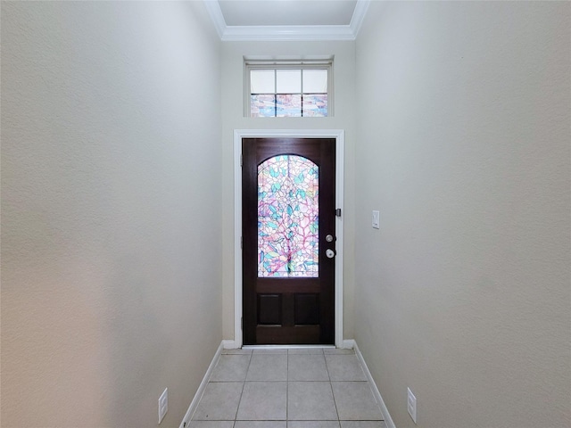 doorway to outside featuring baseboards, light tile patterned floors, and crown molding