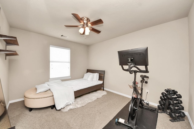 carpeted bedroom featuring baseboards, visible vents, and ceiling fan