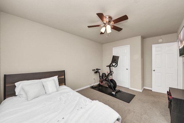 bedroom with ceiling fan, carpet, and baseboards
