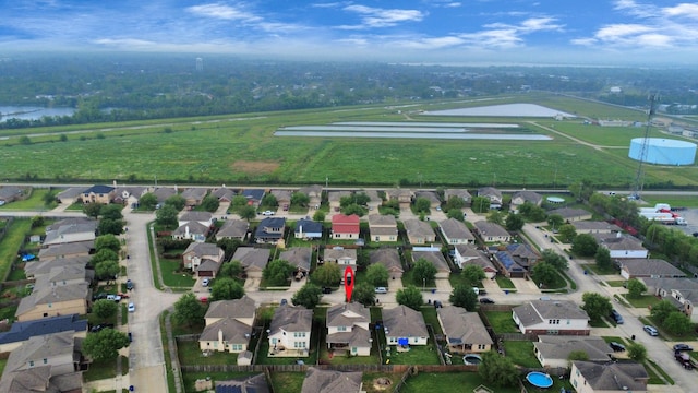 birds eye view of property featuring a water view and a residential view