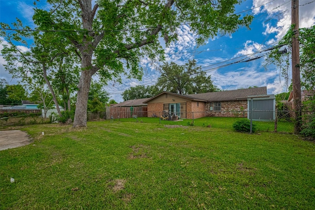 view of yard with a fenced backyard