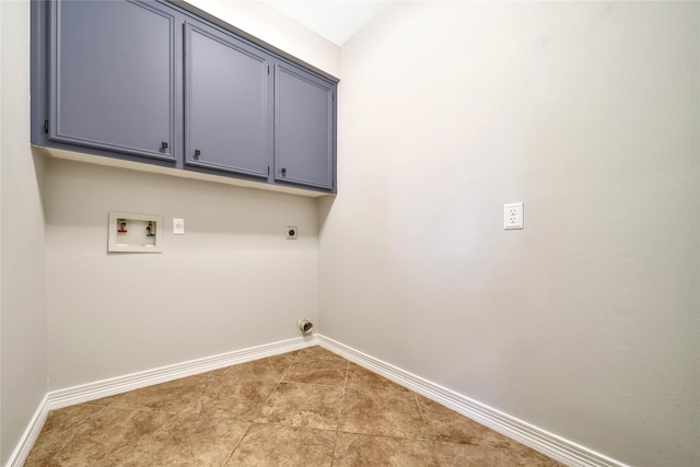 laundry room featuring light tile patterned floors, electric dryer hookup, baseboards, hookup for a washing machine, and cabinet space