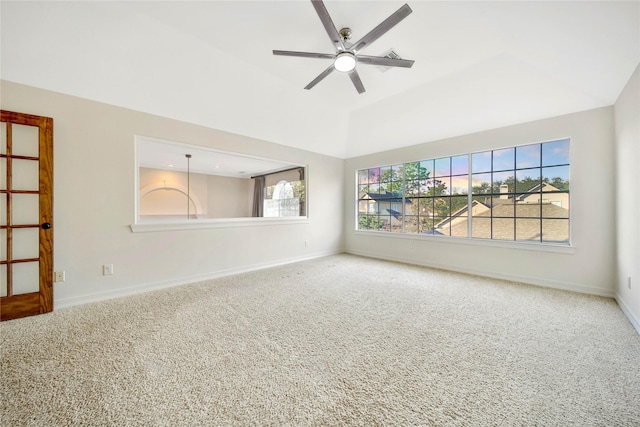 carpeted spare room with baseboards, ceiling fan, and lofted ceiling
