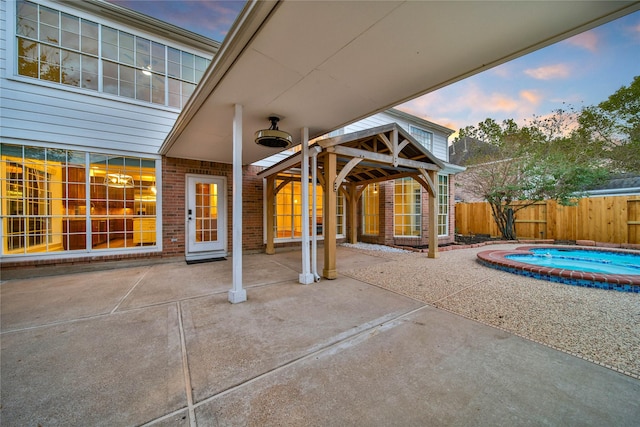 view of patio / terrace with a swimming pool and a fenced backyard