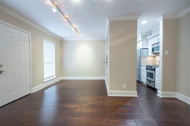 empty room with crown molding, visible vents, baseboards, track lighting, and dark wood-type flooring
