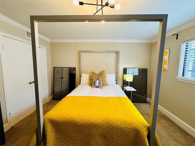 carpeted bedroom featuring a chandelier, baseboards, and crown molding