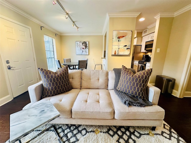 living area featuring baseboards, wood finished floors, rail lighting, and crown molding