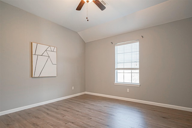 1510 Pecan Trace Ct, Sugar Land, TX 77479 - unfurnished room with wood finished floors, vaulted ceiling, baseboards, visible vents, and a ceiling fan