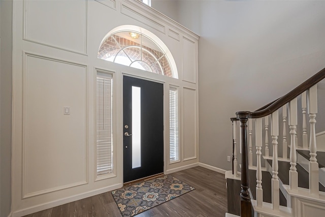 1510 Pecan Trace Ct, Sugar Land, TX 77479 - foyer featuring dark wood-type flooring, baseboards, and stairs