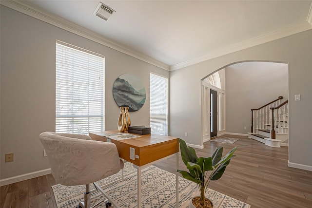 1510 Pecan Trace Ct, Sugar Land, TX 77479 - office featuring crown molding, visible vents, baseboards, arched walkways, and wood finished floors