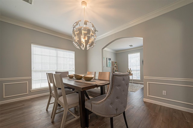 1510 Pecan Trace Ct, Sugar Land, TX 77479 - dining room featuring dark wood-style floors, baseboards, arched walkways, ornamental molding, and a notable chandelier