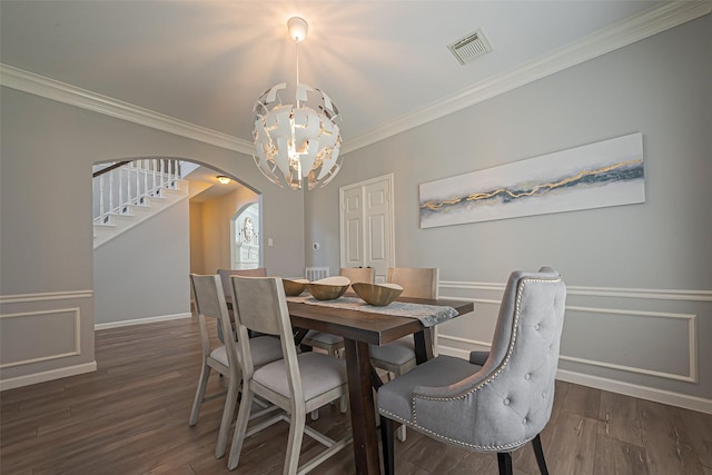 1510 Pecan Trace Ct, Sugar Land, TX 77479 - dining area with an inviting chandelier, crown molding, visible vents, arched walkways, and wood finished floors