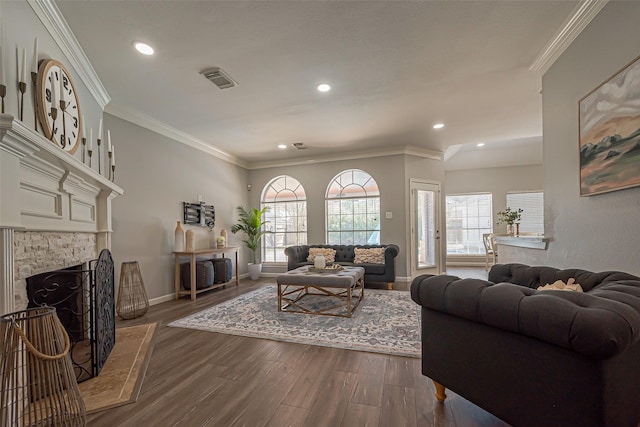 1510 Pecan Trace Ct, Sugar Land, TX 77479 - living room featuring recessed lighting, dark wood-style flooring, a fireplace with raised hearth, baseboards, and crown molding