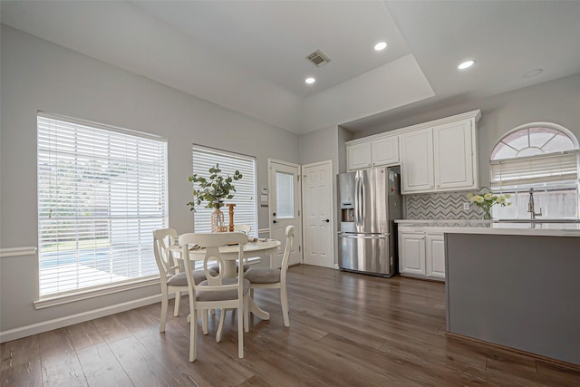 1510 Pecan Trace Ct, Sugar Land, TX 77479 - dining room featuring dark wood-style floors, visible vents, a healthy amount of sunlight, and baseboards