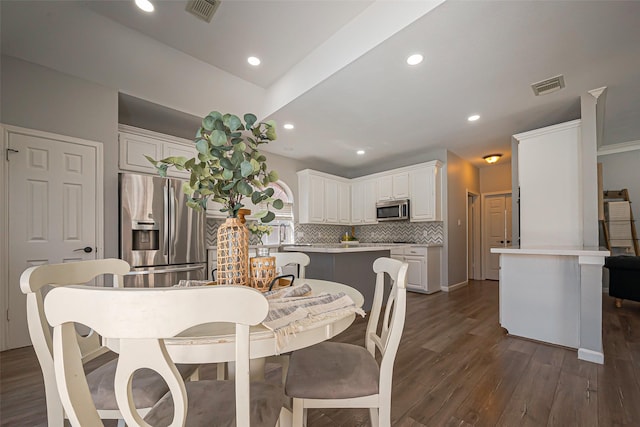 1510 Pecan Trace Ct, Sugar Land, TX 77479 - dining space featuring recessed lighting, visible vents, and dark wood-type flooring