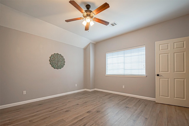 1510 Pecan Trace Ct, Sugar Land, TX 77479 - empty room featuring ceiling fan, visible vents, vaulted ceiling, baseboards, and wood finished floors