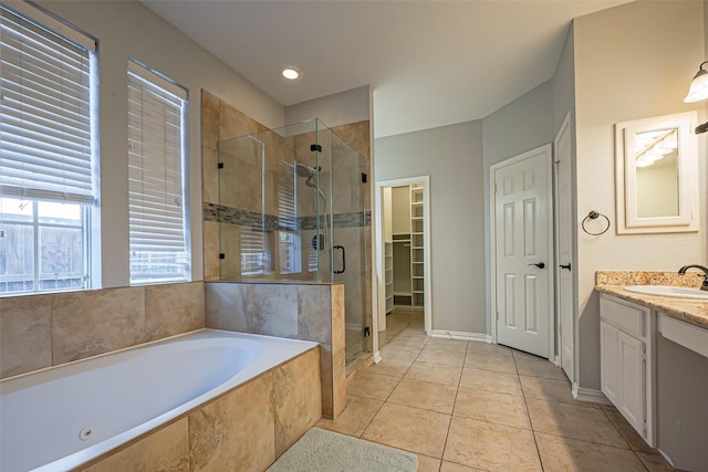 1510 Pecan Trace Ct, Sugar Land, TX 77479 - bathroom featuring a garden tub, a stall shower, tile patterned floors, and vanity