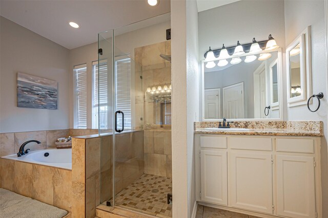 1510 Pecan Trace Ct, Sugar Land, TX 77479 - bathroom featuring recessed lighting, a stall shower, a garden tub, and vanity