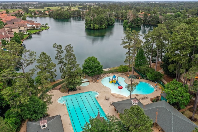 bird's eye view of a nearby body of water and a pool area