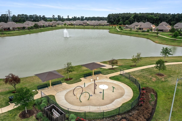 aerial view of residential area featuring a large body of water