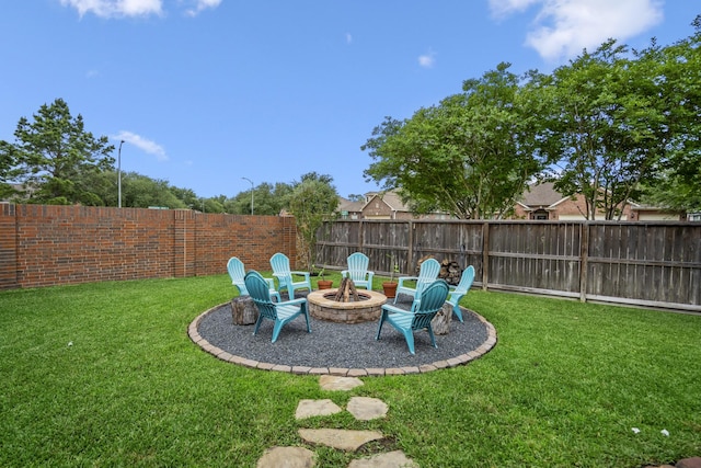 view of yard with an outdoor fire pit