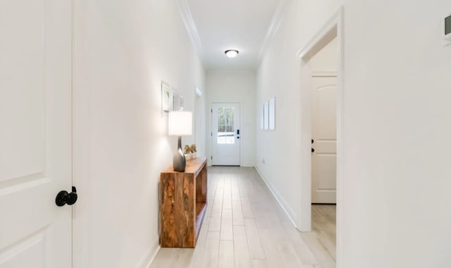 1575 Little Cypress Loop, Orange, TX 77632 - corridor featuring crown molding, light wood-style floors, and baseboards