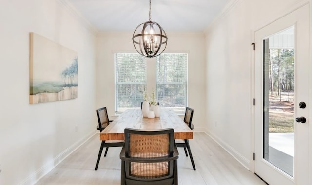 1575 Little Cypress Loop, Orange, TX 77632 - dining area with a chandelier, healthy amount of natural light, ornamental molding, and light wood-type flooring