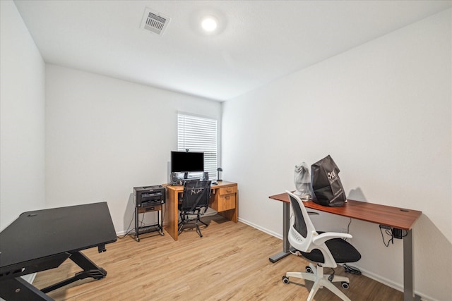 8834 Wooster Trails Dr, Baytown, TX 77521 - office space featuring baseboards, visible vents, and wood finished floors