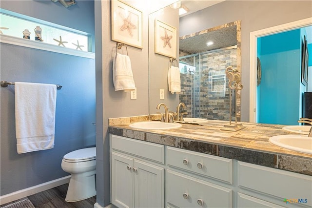 106 Clement Cv, Port Lavaca, TX 77979 - full bath featuring a shower stall, double vanity, and a sink
