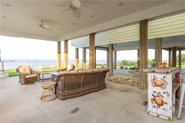 106 Clement Cv, Port Lavaca, TX 77979 - view of patio / terrace featuring an outdoor living space, ceiling fan, and a water view