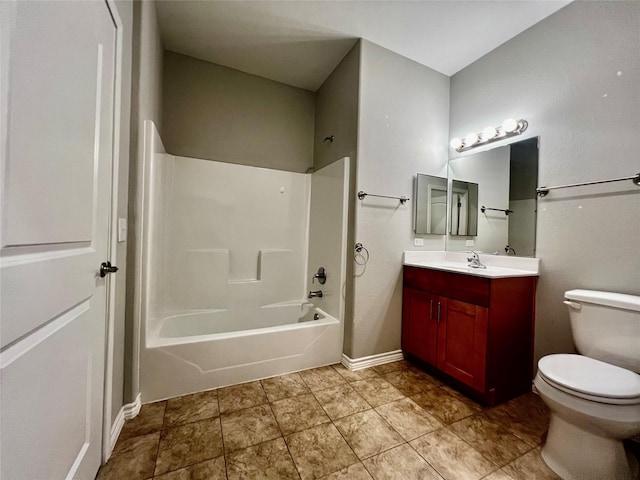 bathroom with baseboards, toilet,  shower combination, and vanity