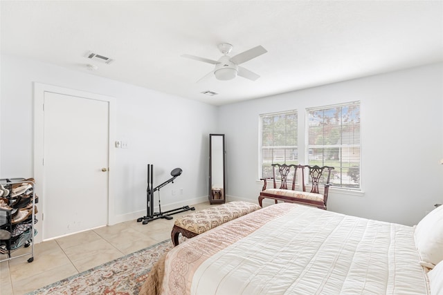 bedroom featuring light tile patterned floors, baseboards, ceiling fan, and visible vents