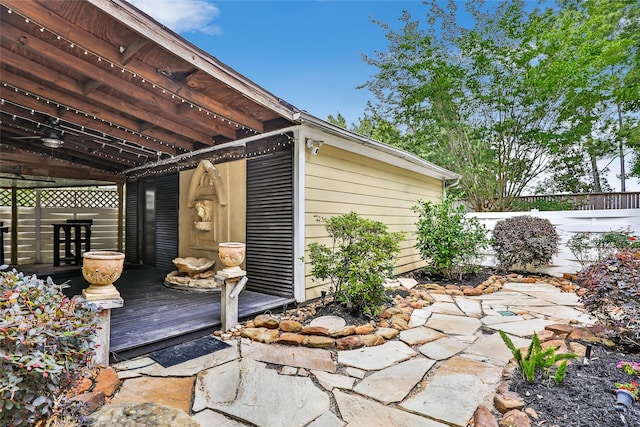 view of outbuilding featuring fence