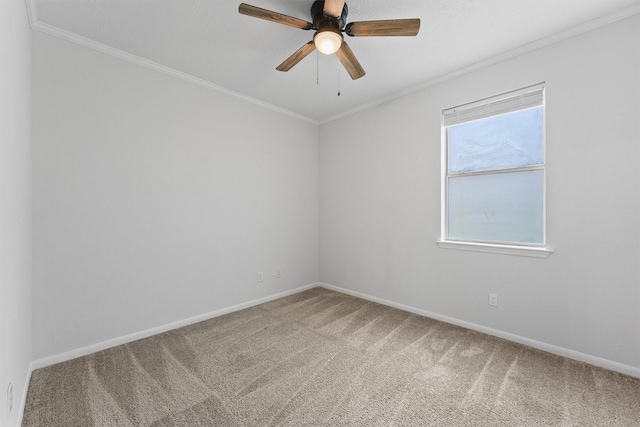 unfurnished room with baseboards, ornamental molding, and carpet floors