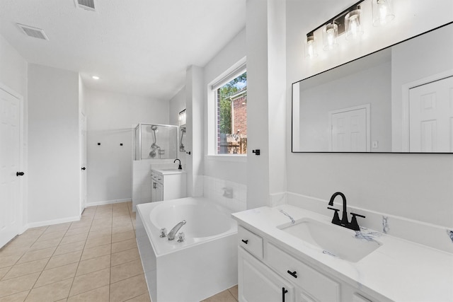 full bath with tile patterned floors, a bath, a stall shower, and a sink