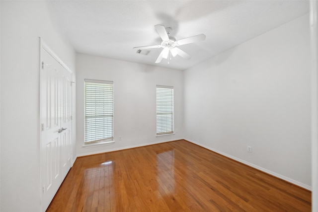 331 Moonshine Hill Rd, Houston, TX 77338 - unfurnished bedroom featuring a closet, visible vents, ceiling fan, wood-type flooring, and baseboards