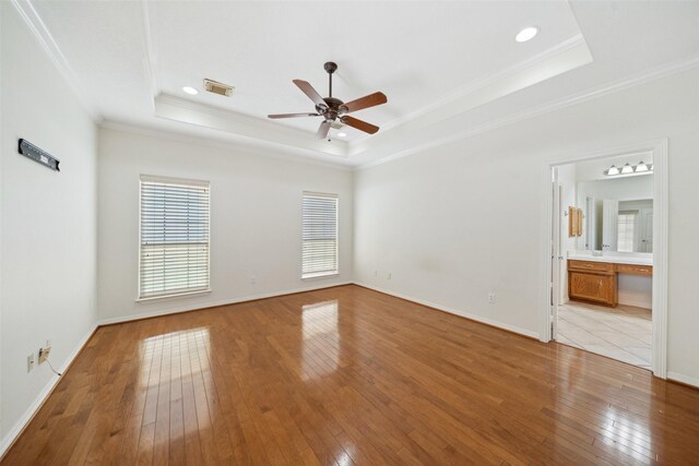 331 Moonshine Hill Rd, Houston, TX 77338 - interior space featuring crown molding, a raised ceiling, hardwood / wood-style floors, and visible vents
