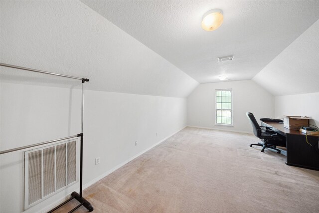 331 Moonshine Hill Rd, Houston, TX 77338 - office with a textured ceiling, visible vents, lofted ceiling, and carpet floors