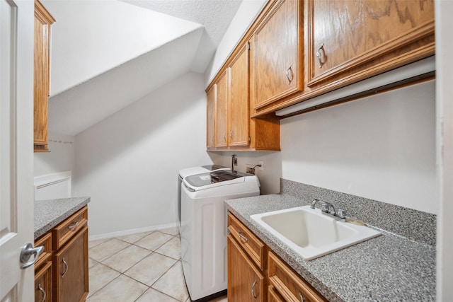 331 Moonshine Hill Rd, Houston, TX 77338 - clothes washing area featuring light tile patterned floors, baseboards, a sink, separate washer and dryer, and cabinet space