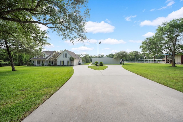 331 Moonshine Hill Rd, Houston, TX 77338 - exterior space featuring a lawn, curved driveway, and a garage