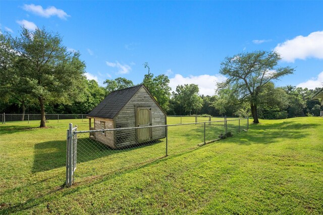 331 Moonshine Hill Rd, Houston, TX 77338 - view of yard with an outdoor structure, a shed, and fence