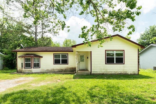 ranch-style home with a front yard
