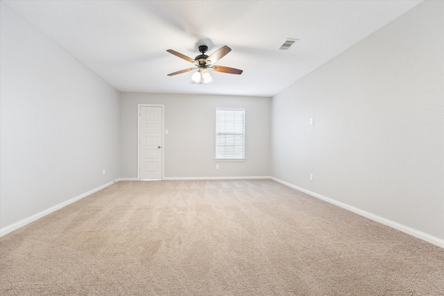 unfurnished room featuring visible vents, ceiling fan, light colored carpet, and baseboards